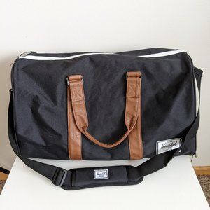 Herschel Novel Black and Tan Synthetic Leather Duffle